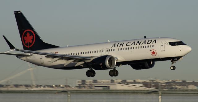 Boeing 737 MAX 8 (C-GELQ) - Flaring on 17L, yes, thats a downed crane in the background.