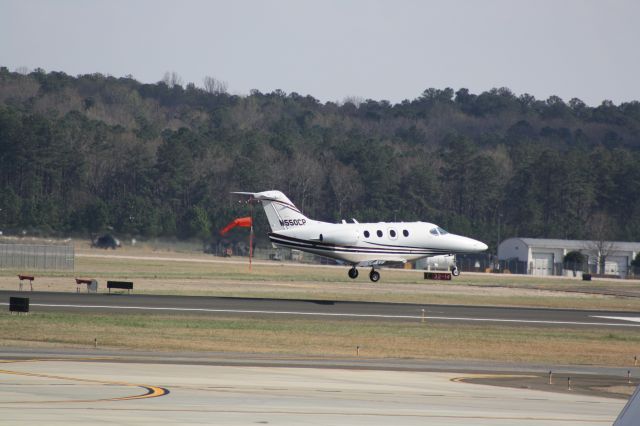 Beechcraft Premier 1 (N550CP) - N550CP about to touch down runway 23L