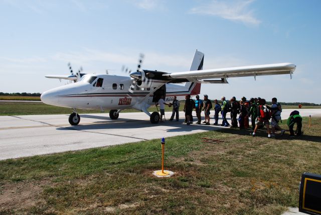 De Havilland Canada Twin Otter (N128WJ) - A SkyDive Arizona 'Twotter' loading jumpers at Dollar Days 2012.