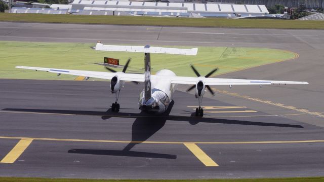 de Havilland Dash 8-300 (ZK-NFI) - Note the aircraft is positioned sideways to avoid the wind blowing into the engines as turboprops "do not like it"