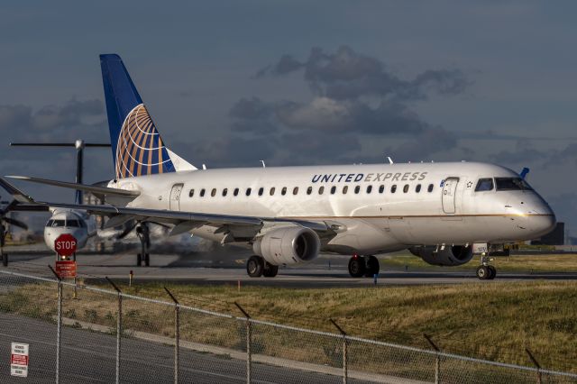 Embraer 175 (N107SY) - 18th July, 2022: United Express operated by SkyWest holding short of runway 06R at Toronto's Pearson Airport.