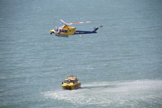 Bell 412 (VH-EPR) - Working with the Coast Guard on simulated exercise … dropping life raft and then lower to and retrieve Doctor from boat deck.