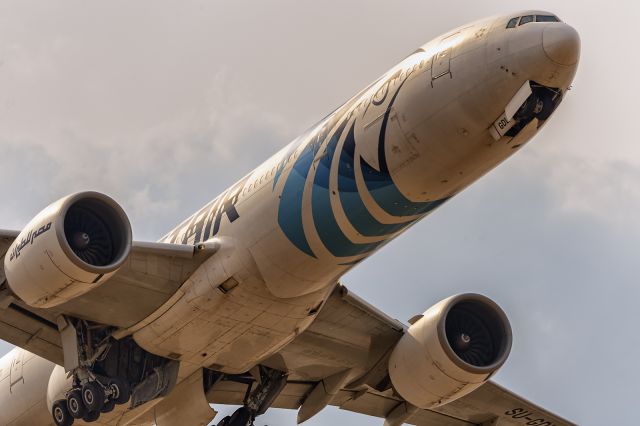 BOEING 777-300 (SU-GDL) - 14th August, 2022: Belly of the beast shortly after rotation from runway 09R flying over Myrtle Avenue en route to Cairo as flight MS 778.