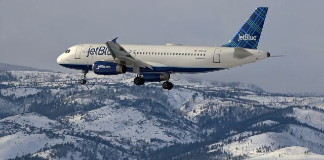 Airbus A320 (N561JB) - "La Vie en Blue" (The Life in Blue), JBUs N561JB, is clicked on the last two thousand feet of its s/final approach to Reno Tahoe International with the snow-covered Sierra Nevada in the background.  The A320 was arriving from Long Beach.br /* If best quality viewing is desired, use FULL to see the actual size. *