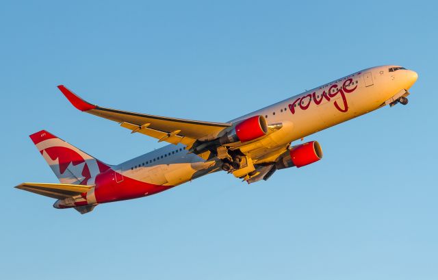 BOEING 767-300 (C-GHPE) - ROU1668 climbs off runway 24L and heads to Fort Lauderdale