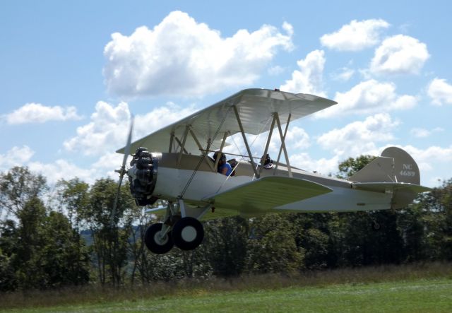 TRAVEL AIR B (NC4689) - Shown departing is this 1928 Travel Air 2000 Bi-plane in the Summer of 2018. This aircraft could reach 132 mph with a range over 500 miles and with a ceiling of 18,000 feet.