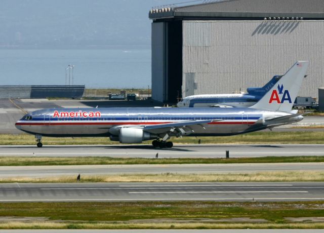 BOEING 767-300 (N357AA) - KSFO - AA workhorse 767 rolling out on 28R and ready to cross 28L when ready.....4-1-2005