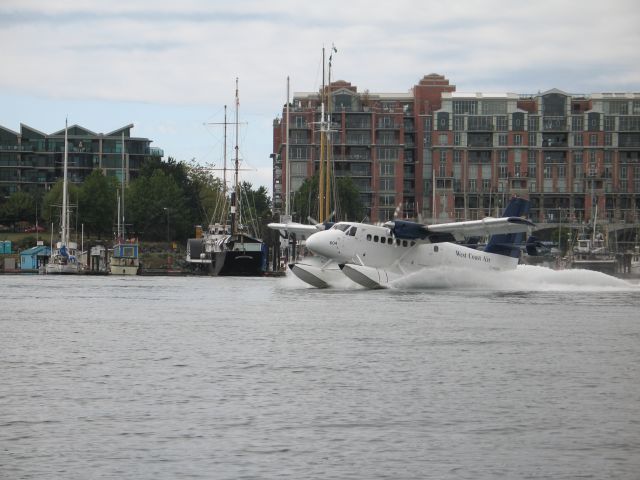 C-FGQH — - A Twin Otter from West Coast Air lands in the harbor in Victoria, BC.  What a fun place to fly!