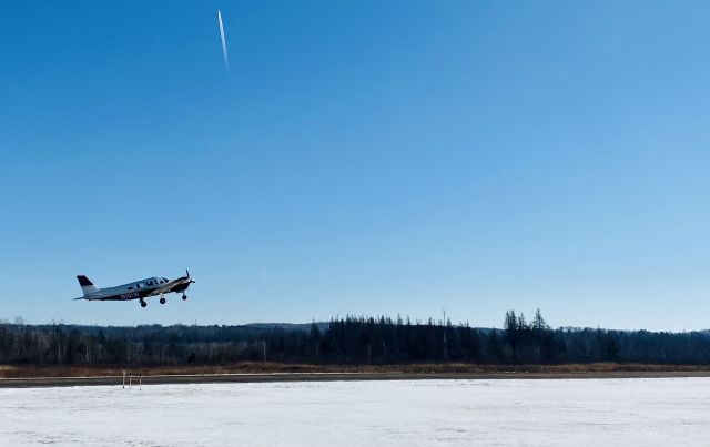 Piper Saratoga (N101W) - On the edge of the taxiway.