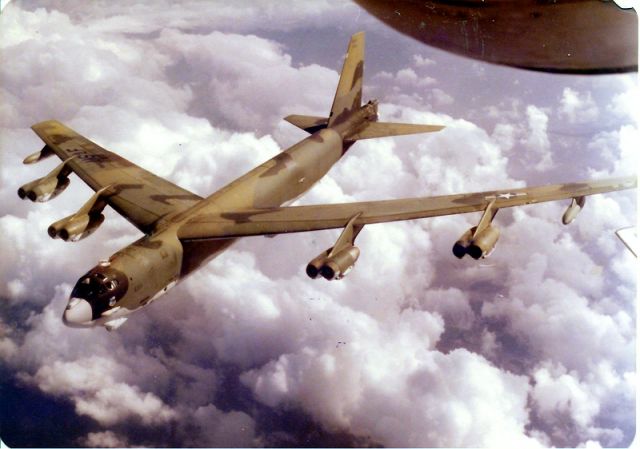 Boeing B-52 Stratofortress (N6511) - I snapped this pix when the B-52G was leaving the boom after a successful air refueling.   I was flying out of TRAVIS at the time.... right around 1980.  I loved the paint job.    Puffy clouds really make the picture!