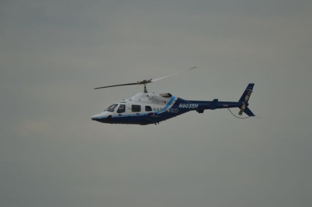 KAWASAKI EC-145 (N903SH) - N903SH flying down Runway 21 prior to Power on the Prairie Airshow in Sioux Falls SD - 7-21-2012