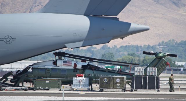 — — - Unloading a VH-60N for a visit to KRNO/Reno.  It takes manpower to unload.  POTUS  was attending a conference in Lake Tahoe.  