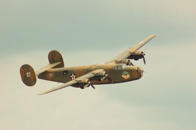 Consolidated B-24 Liberator — - The sun peeks through the clouds on Ol 927 as it does a fly-by at Wings Over Houston 2010.