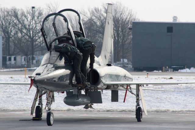 Northrop T-38 Talon (AFR67857) - Leaning in to the cockpit.br /br /Preflight for the Vance AFB T-38 Talon prior to Green Bay Packer National Anthem fly-over. 