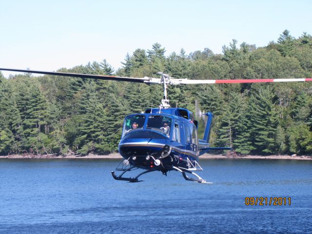 Bell VH-1 (C-GPNS) - This  is a Bell 212 just about to land at Mc Gowan Lake Nova Scotia