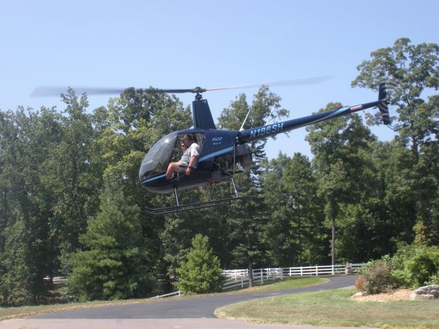 Robinson R-22 (N186SH) - Paul Salmon, CFII and Tim Brumitt- student 2010 , departing Tims driveway