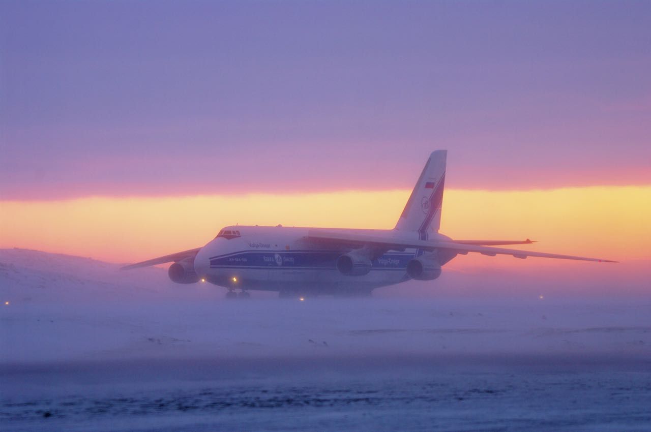 Antonov An-124 Ruslan (RA-82044) - The Wind is picking up and its going to be a cold and windy night for the crew to work off loading the cargo. 