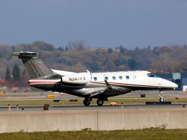 Embraer Phenom 300 (N347FX) - Landing on 12R as viewed from the new viewing area at MSP on 2015-10-30