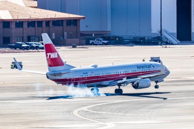 Boeing 737-800 (N915NN) - An American Airlines 737-800 in TWA retro livery landing at PHX on 2/28/23. Taken with a Canon R7 and Canon EF 100-400 L ii lens.