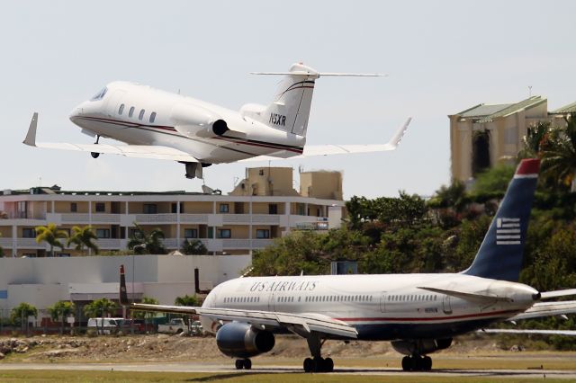 Learjet 55 (N5XR) - N5XR departing TNCM runway 28 and US airways in the bipass holding at Alpha