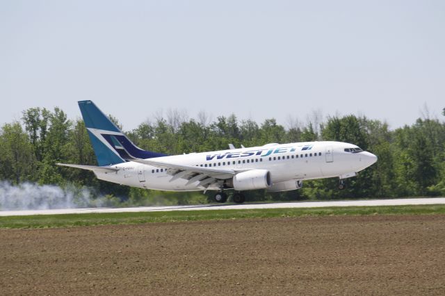 Boeing 737-700 (C-FBWJ) - Landing CYXU,London,Canada..June 5,2014