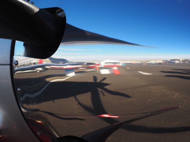 — — - Sept 15, 2018 Reno Air Races.  Western Aircraft PC-12NG  Reflection in nose cone.