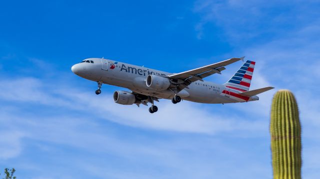 Airbus A320 (N103US) - American Airlines A320 landing at PHX on 8/9/22. Taken with a Canon 850D and Canon 50mm f/1.4 lens