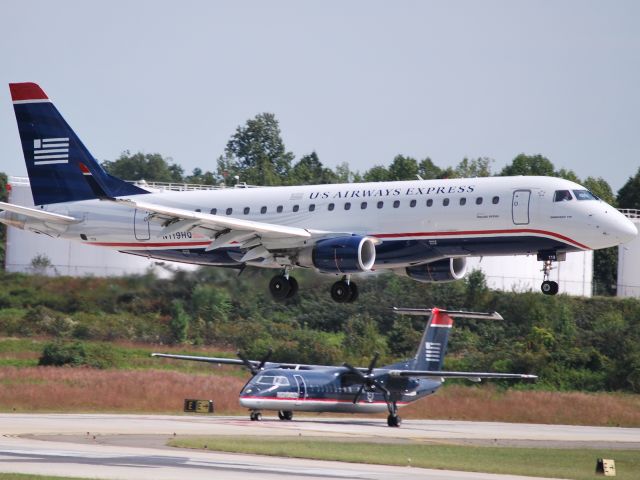 Embraer 175 (N119HQ) - Arriving runway 18C - 10/4/09