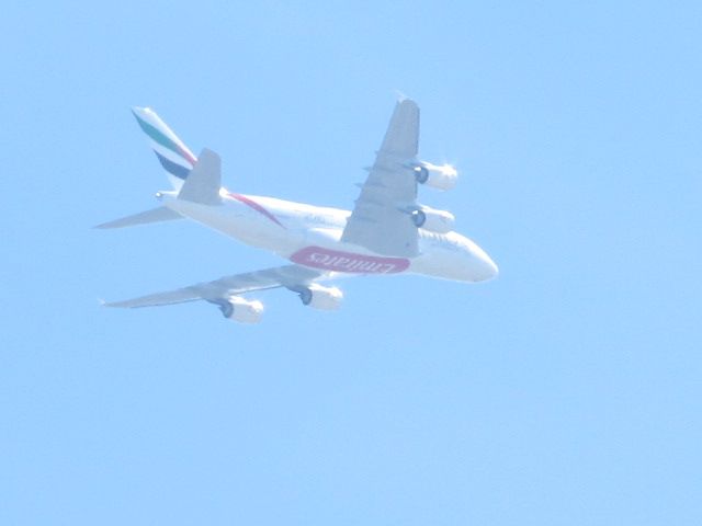 — — - Emirates big whale finals into Pearson International being viewed from my verandah in Brampton