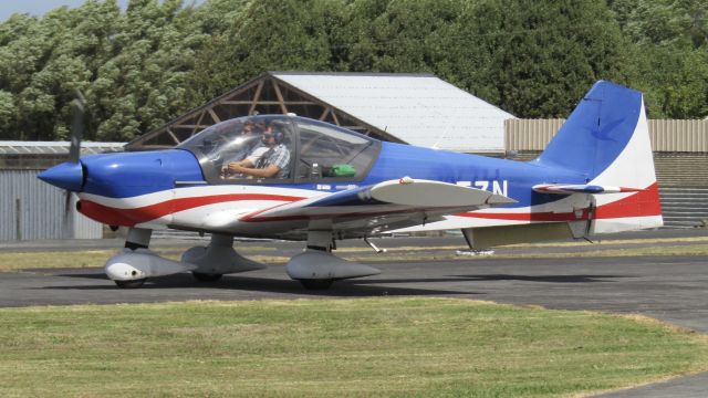 ROBIN R-2160 Alpha Sport (ZK-TZN) - North Shore Aero Club's TZN departing for a brief flight around the local area. Note how the aircraft hasn't been repainted in aero club colours yet, and that the previous registration is still partly visible.