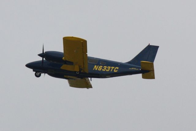 Piper Seneca (N633TC) - N633TC flies over Sarasota-Bradenton International Airport