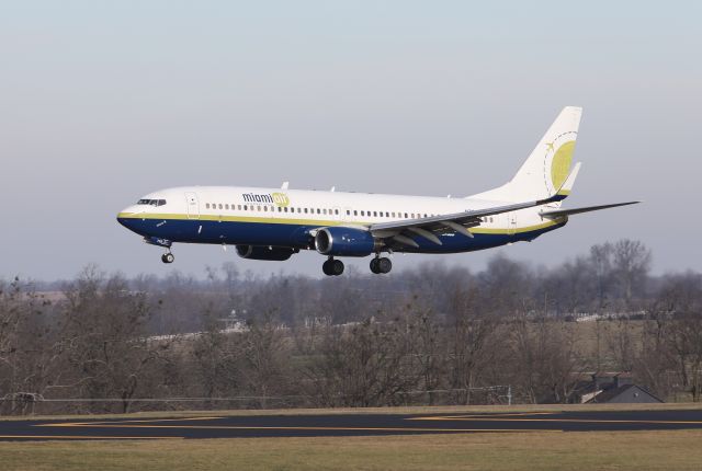 Boeing 737-800 (N732MA) - Miami Air (Biscayne) 195 fresh in from Bedford, MA crossing runway 22 threshold at KLEX Lexington Bluegrass Airport.