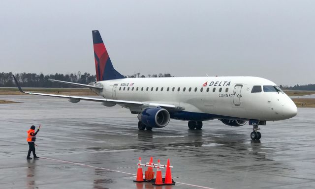 Embraer 175 (N206JQ) - Pulling into the gate on a rainy afternoon.