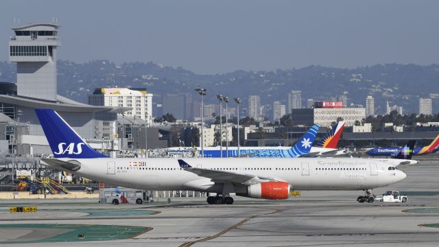 Airbus A330-300 (SE-REH) - Getting towed to gate at LAX