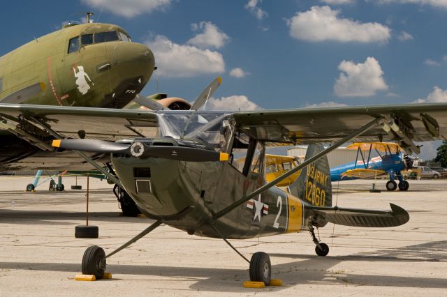 Cessna L-19 Bird Dog — - Cessna O-1 Bird Dog on display at a Commemorative Air Force event. This aircraft started life with the French Army.