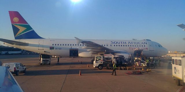 ZS-SZI — - Lovely sight of A320 (ZS-SZI) as we pushed back at Johannesburg OR Tambo International Airport, 4.11.2002
