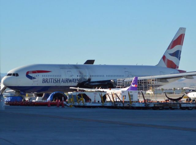 Boeing 777-200 (G-VIIO) - Poor VIIO:(  You can see parts of the engine on the ground covered by a blue tarp. RIP