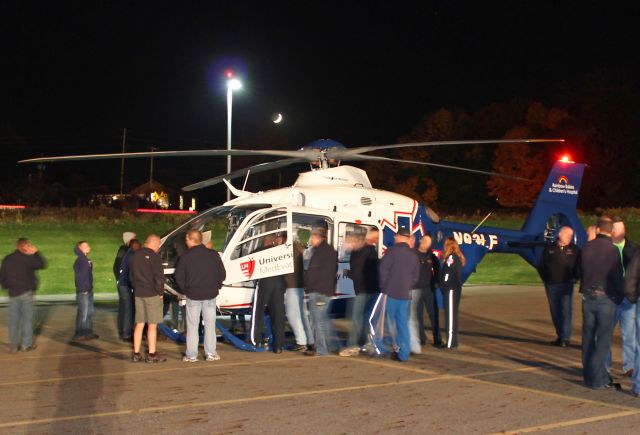 Eurocopter EC-635 (N93LF) - Several firefighters surround N93LF, a University Hospitals MedEvac Eurocopter EC135 T2, c/n 412, just after arriving landing at the helipad at Akron General Hospital in Copley, Ohio. University Hospitals MedEvac, MedFlight Ohio, and Metro Life Flight all participated in a joint-training session for firefighters responding to MedEvac emergencies on 18 Oct 2012. A classroom session was held followed by a close-up walk-around of the helicopters.