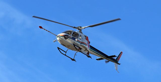 Eurocopter AS-350 AStar (C-GSVY) - A Eurocopter (Aerospatiale) AS350B Ecureuil equipped with a boom that enables mineral exploration approaches to land at Stellar Aviation for a brief stopover before continuing a trip to Boulder City (KBVU).