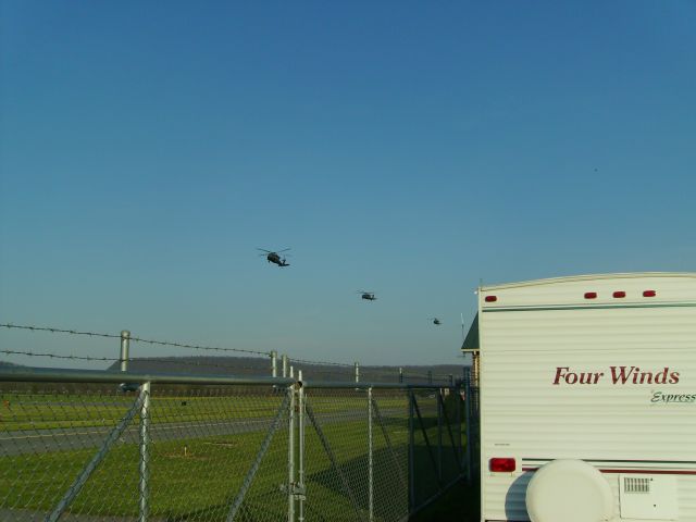 UNKNOWN — - Blackhawks formation flying down runway 31.