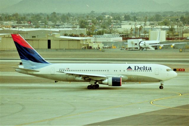 BOEING 767-200 (N103DA) - KPHX - LN 17 on taxi to the departure runway for ATL. This photo was March/April late 1990s or early 2000.