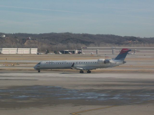 Canadair Regional Jet CRJ-900 (N813SK) - Delta 3973 to Salt Lake City with a CRJ-900 in Colors in Motion taxing to runway 14R. 