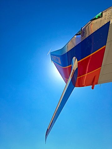 Boeing 737-700 — - Perfect timing with the contrails above the winglet!