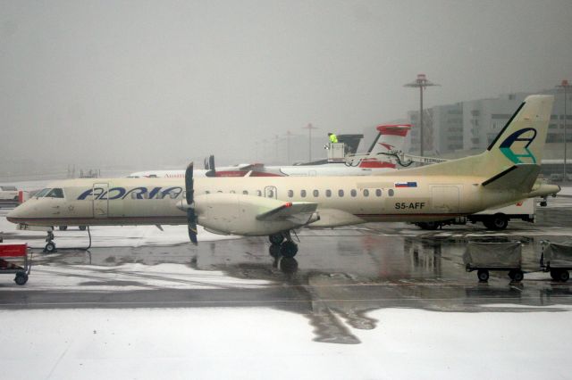 Saab 2000 (S5-AFF) - Being de-iced on stand on 24-Jan-19 prior to operating Swiss flight SWR2902 to LSZA.