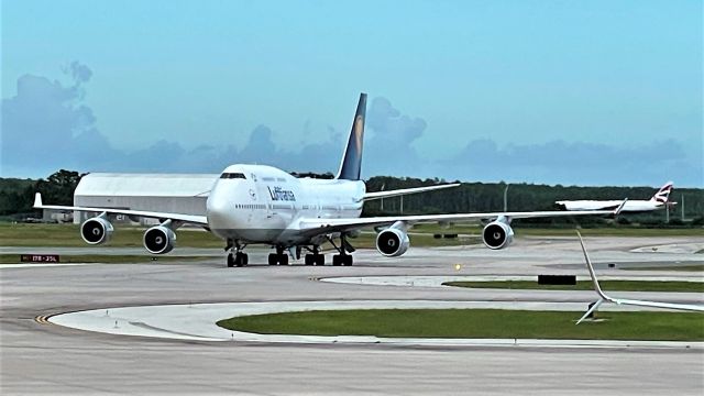 Boeing 747-400 (D-ABVZ) - Arriving as LH464 from FRA with G-VIIV from LHR decelerating in the background