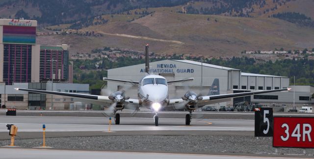 Beechcraft King Air 90 (N991GT) - A Beechcraft King Air (N991GT) turns on to Taxiway Juliet after landing on Runway 34R to complete an early morning (6:50 AM) arrival. The Medevac aircraft was returning from SFO.