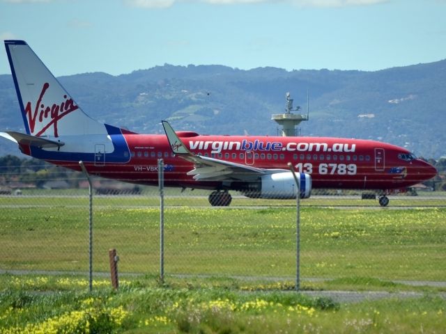 Boeing 737-700 (VH-VBK) - On taxi-way heading for a short take off run on runway 05.