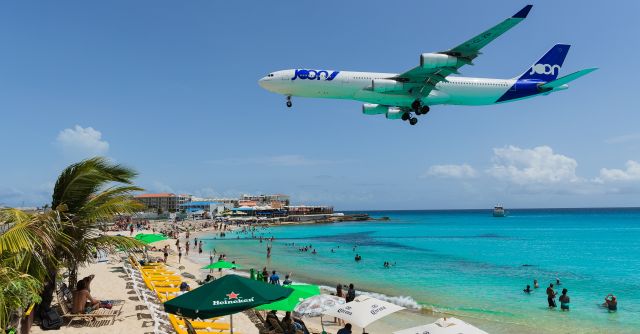 Airbus A340-300 (F-GLZP) - Low cost carrier Joon flying for Air France as Afr498 with the airbus A343 registration F-GLZP seen over maho beach for landing at TNCM St Maarten.br /11/08/2018