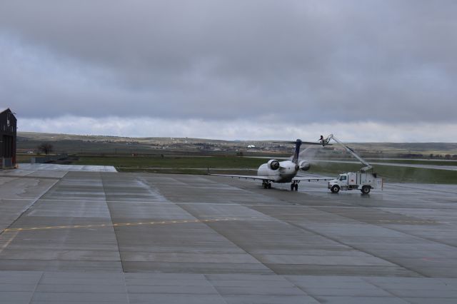 Canadair Regional Jet CRJ-700 (N156GJ) - From the observation deck at KCPR deicing