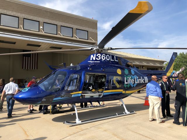 Piper Cheyenne 400 (N360LL) - Standing on the helicopter Pad at Marshfield Clinic Health System sits the new Life Link iii Augusta Westland AW119MKII